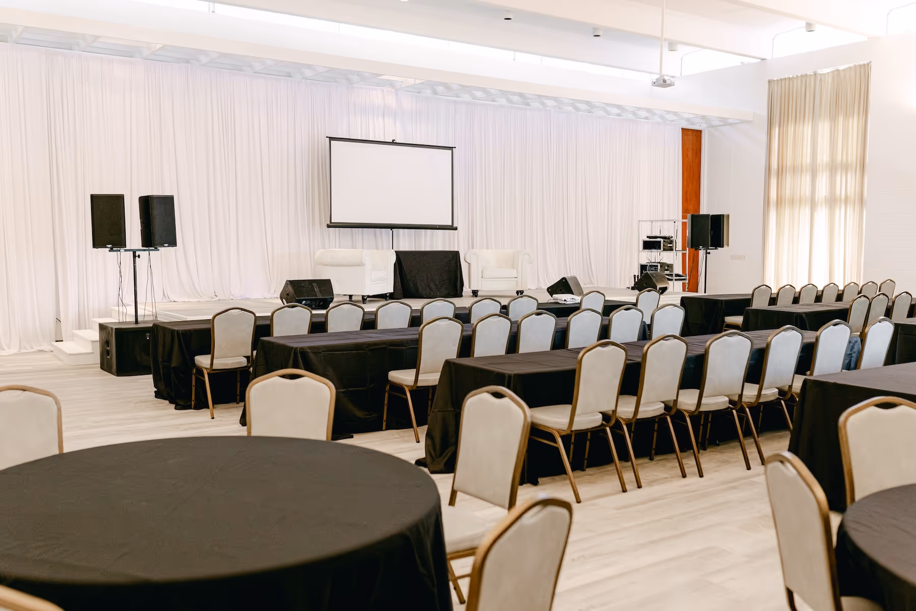 Spacious event hall with elegant decor at Oak Place